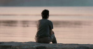 Adult reflecting on healing emotional wounds from childhood